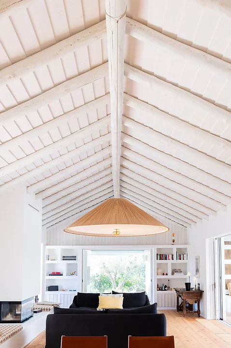 White vaulted ceiling with exposed beams and large rattan pendant light at Casa AHA at Casa AHA!, Carvalhal / Comporta