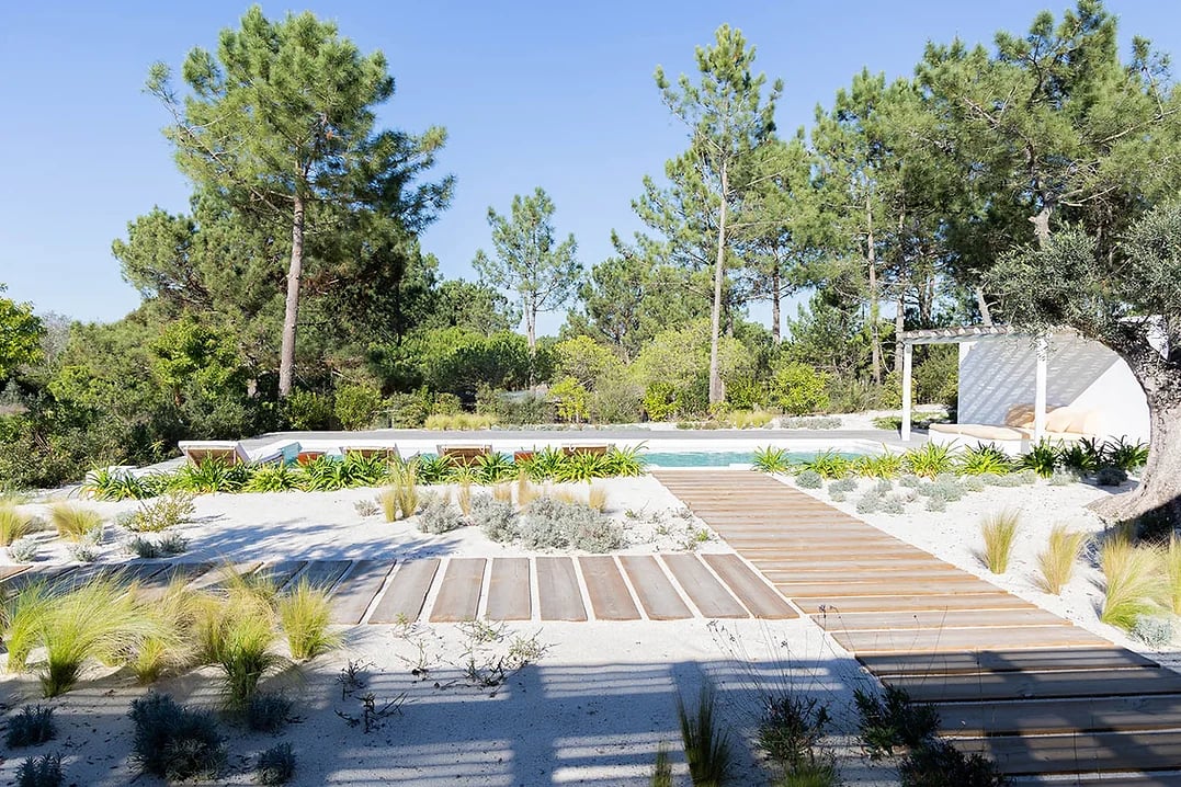 Outdoor pool area with sun loungers and wooden walkway at Casa AHA at Casa AHA!, Carvalhal / Comporta