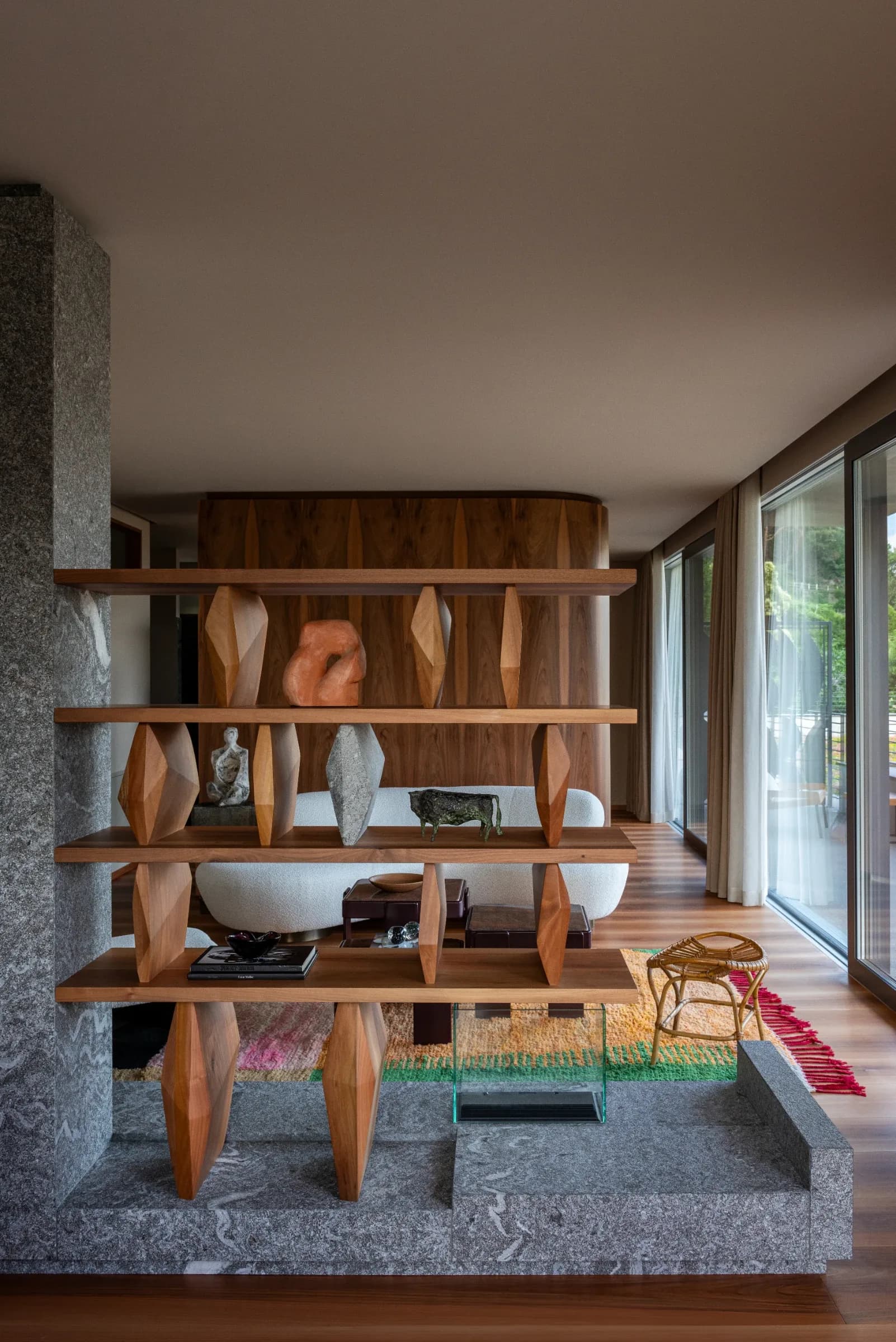 Living room with modern wooden divider and floor-to-ceiling windows at Rafter Merano Algund in Italy