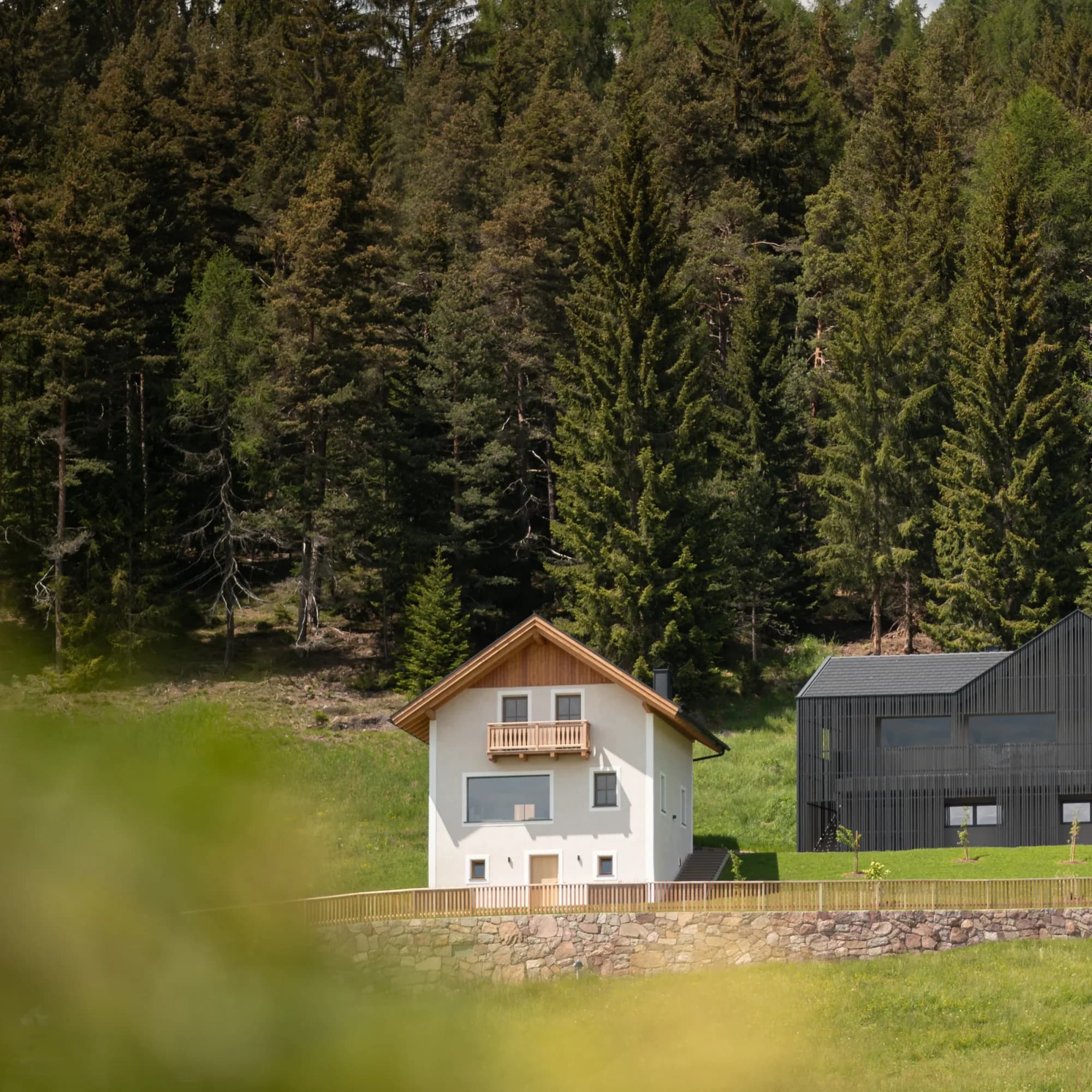 Rafter Bolzano Ritten holiday rental exterior with forest backdrop in Oberinn, Italy near mountain escape