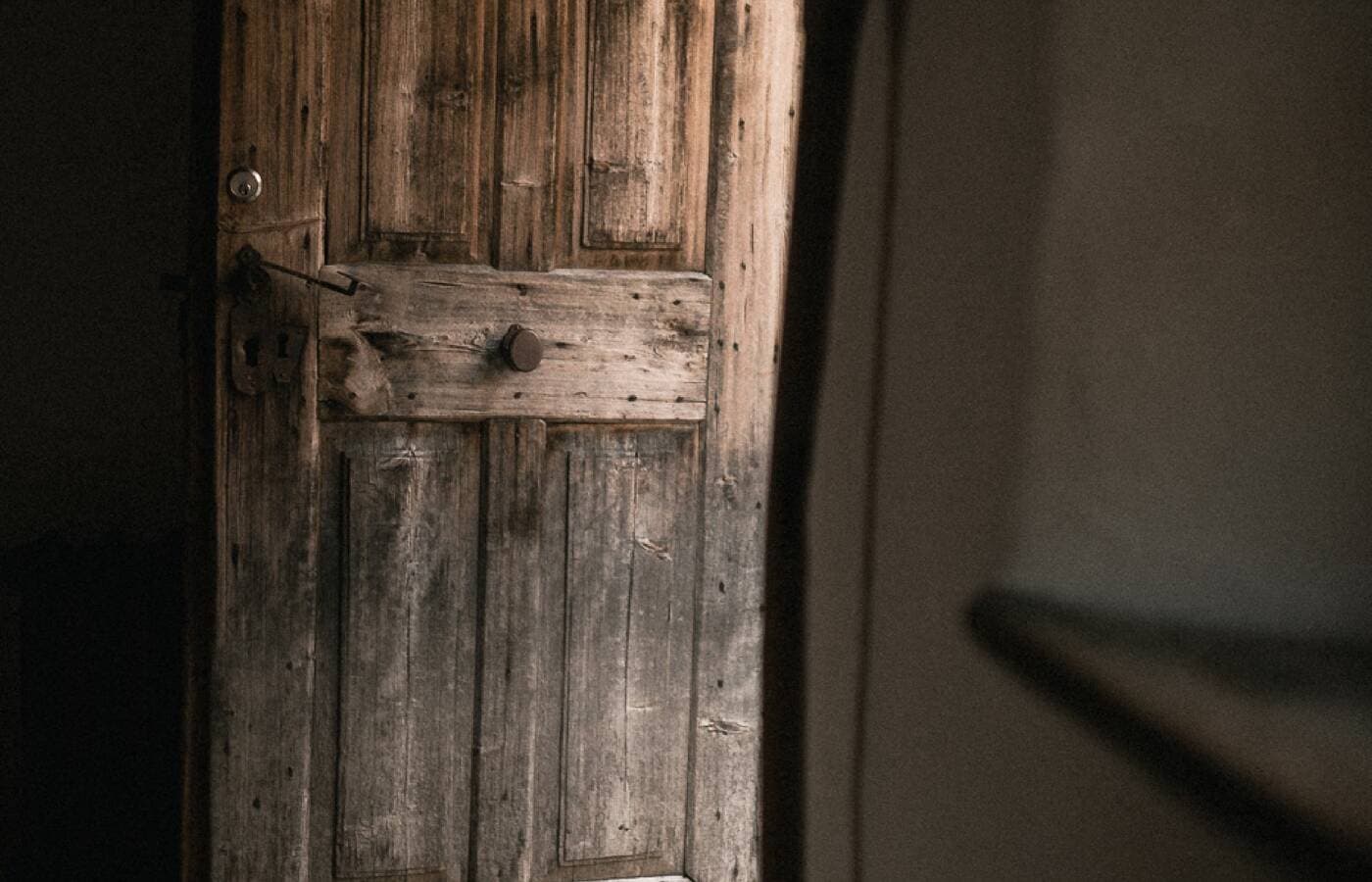 Rustic wooden door detail at Rafter Villanders holiday rental in Villanders, Italy